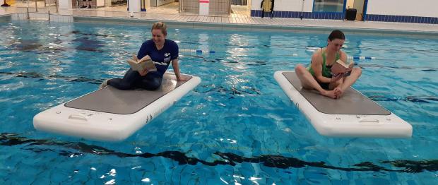 Barrhead News: Claire Davidson and Lynne O’Neill took part in the ‘keep the heid and read’ initiative during their FloatFit class
